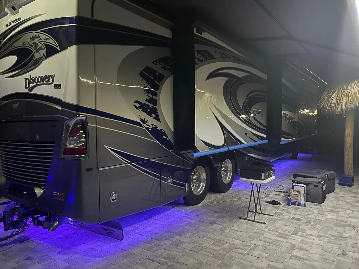 Discovery motorhome with violet underglow