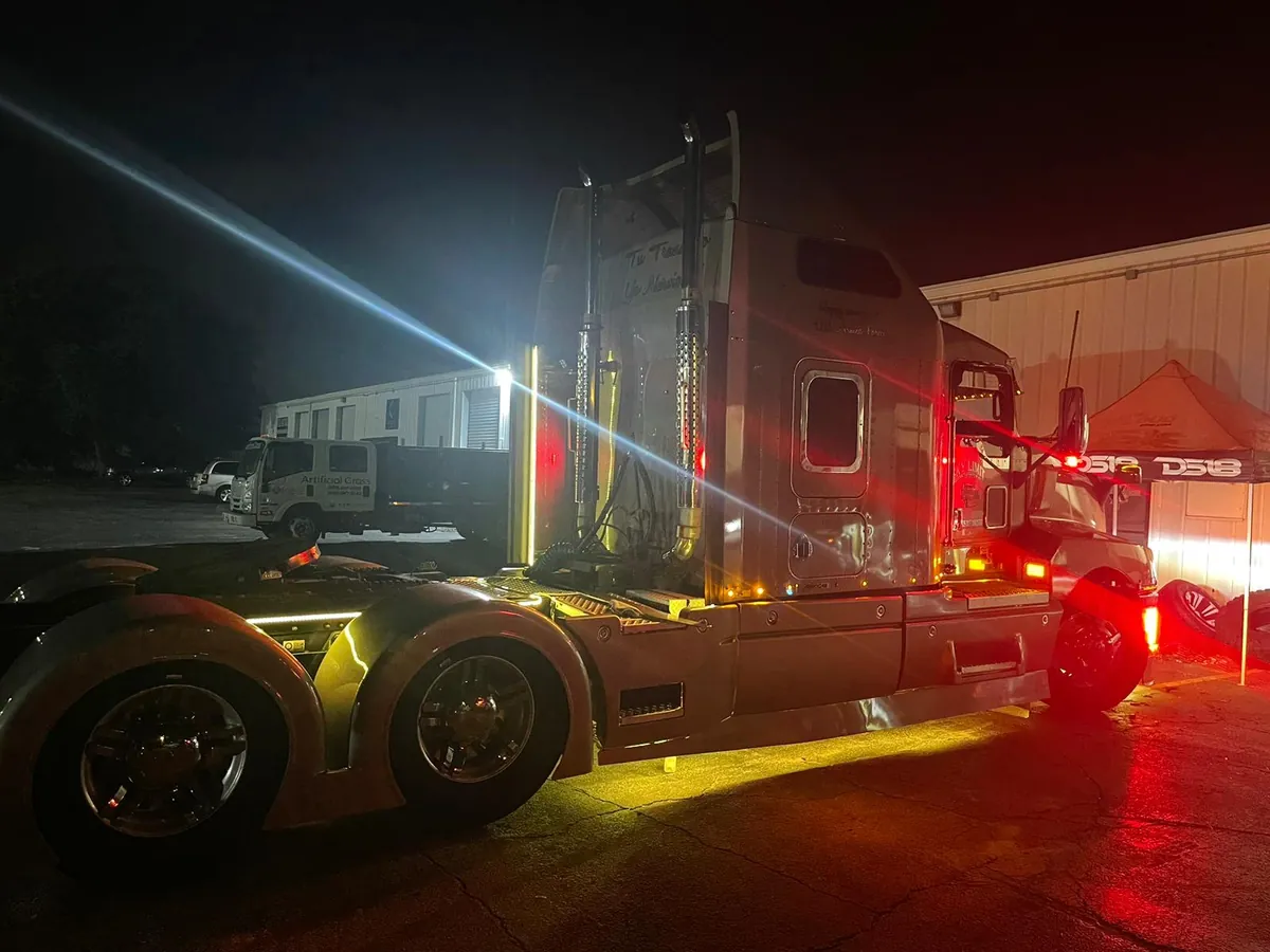Semi truck cab with amber and red underglow