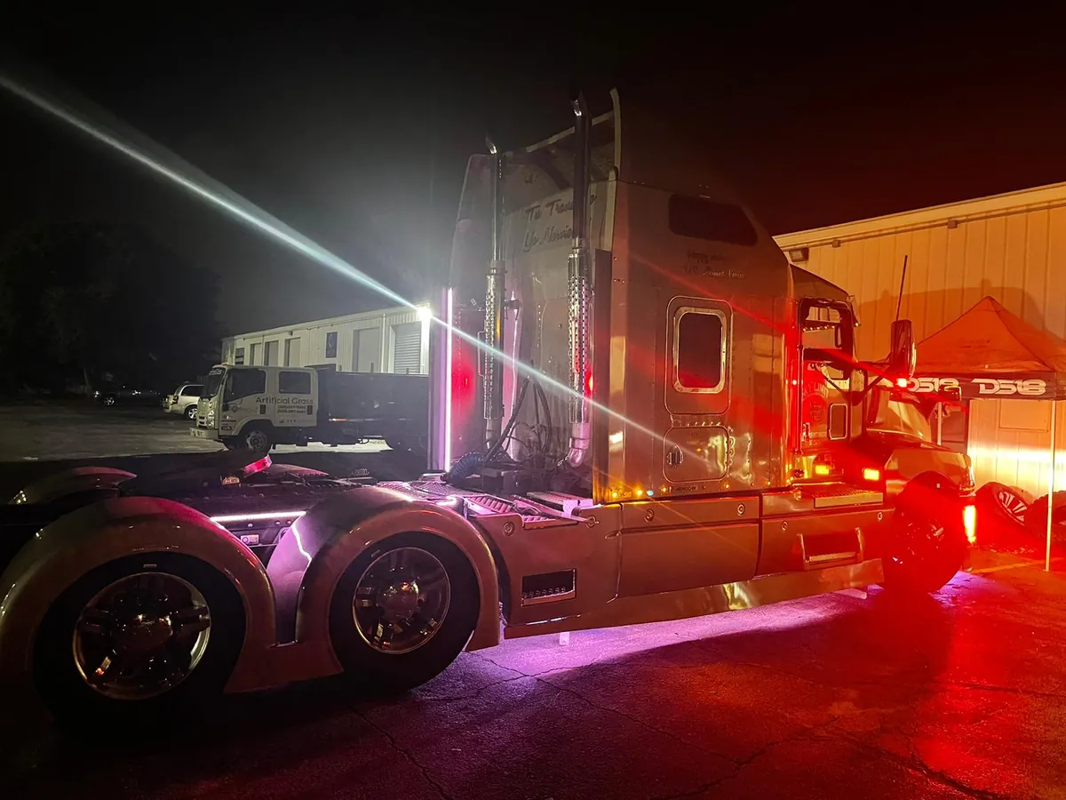 Truck with magenta underglow lighting